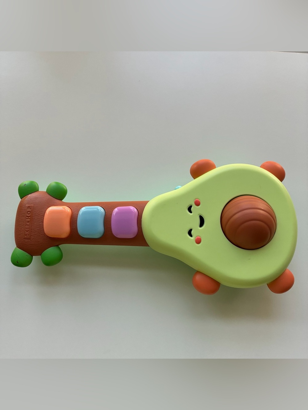 Skip Hop Farmstand Rock-A-Mole avocado baby music toy guitar